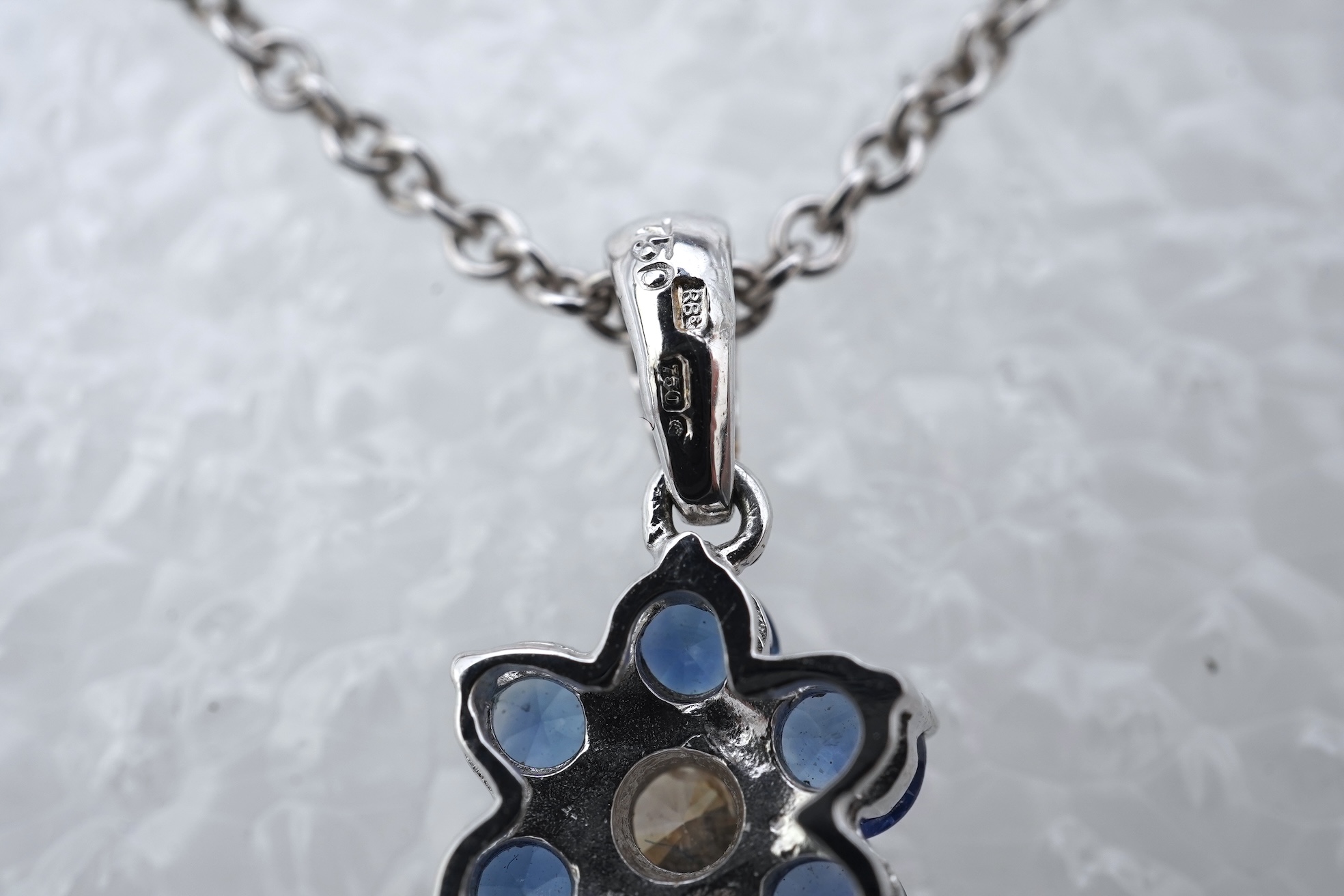 A sapphire and diamond pendant